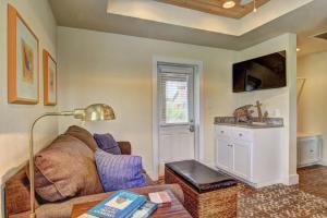 a living room with a couch and a table at Centrally Located 5 Min to Beach Screen Porch in Port Aransas +9 photos