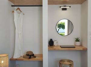 a room with a mirror and a shelf at Rhodes Soul luxury suites in Afantou