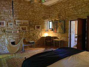 a bedroom with a bed and a table in a room at Château de Monsac in Monsac