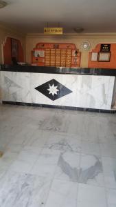 a room with a counter with a tile floor at Al Khaleej Hotel Apartments in Amman