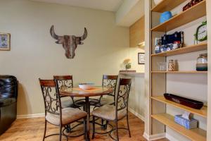 a dining room with a table and two chairs at Go With The Flow CW B103 in New Braunfels