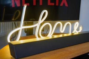 a sign that says nintendo on top of a desk at Orchard Bungalow - Sleeps 10 - Close to Town Centre - Free Parking, Pool Table, Fast Wi-Fi and Smart TV with Netflix by Yoko Property in Northampton