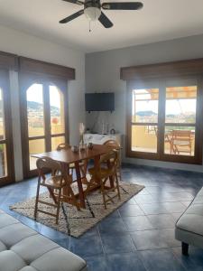 a dining room with a wooden table and chairs at APPARTEMENT-NICE 01 VUE MER - PANORAMIQUE WIFI-Parking in Nice