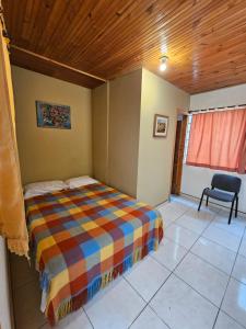 Postel nebo postele na pokoji v ubytování Casa Hotel Bonita