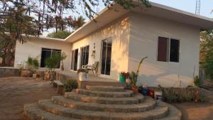 a house with stairs in front of it at Casa brisas del mar in Ipala