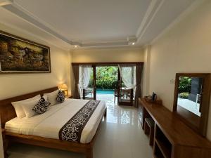 Ένα ή περισσότερα κρεβάτια σε δωμάτιο στο Saputra Guesthouse