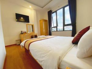 Postel nebo postele na pokoji v ubytování S481 Hoa Dang Hotel Dalat