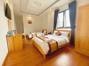 Postel nebo postele na pokoji v ubytování S481 Hoa Dang Hotel Dalat