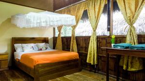 Krevet ili kreveti u jedinici u objektu Caiman Eco Lodge