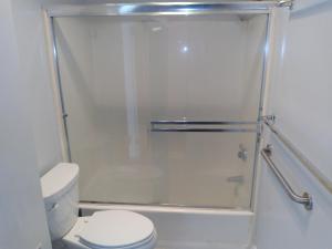 a bathroom with a shower with a toilet at LA Love Home in Los Angeles