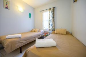 Postel nebo postele na pokoji v ubytování Well placed apartment with courtyard 300m from port