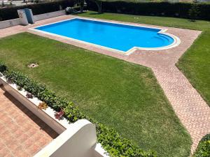 an image of a swimming pool in a yard at Luxury Apartment with Pool in Agadir Bay 5 Min Walk to Beach in Agadir