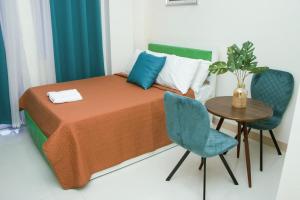 Postel nebo postele na pokoji v ubytování Amar Residence