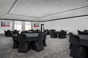 a conference room with tables and chairs in it at TownePlace Suites Dallas DeSoto in DeSoto +31 photos