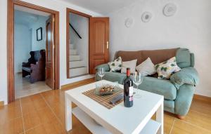 a living room with a couch and a table with wine glasses at Nice Home In Algodonales With Wifi in Algodonales +8 photos