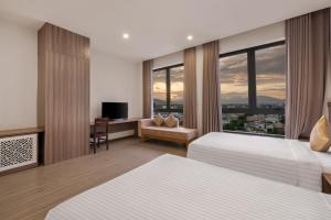 Postel nebo postele na pokoji v ubytování ATP Galaxy Hotel & Apartment Danang