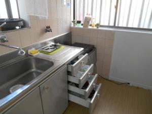a kitchen with a sink and a dishwasher at 駅徒歩5分どこへも大阪駅へ直結どこへもすぐの大型庭付GlampingHouse in Osaka +31 photos