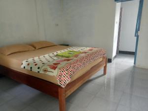 Postel nebo postele na pokoji v ubytování bulan homestay
