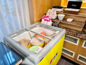a cooler in a room with food inside of it at Hub Hotel Kaohsiung Cisian Branch in Kaohsiung