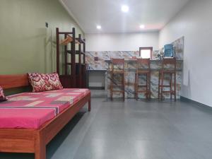Ένα ή περισσότερα κρεβάτια σε δωμάτιο στο Mango Guesthouse