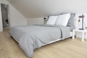 Postel nebo postele na pokoji v ubytování Maison proche de Massy, Antony et Versailles Ouvriers bienvenus