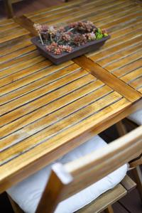 a wooden table with a potted plant on top of it at ONJUKU BEACH HOUSE - private villa 1 min walk to beach with sea view in Onjuku +41 photos
