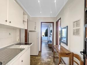 A kitchen or kitchenette at Andromaches large apartment 2