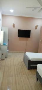 TV a/nebo společenská místnost v ubytování Margereth Cottage suite residence