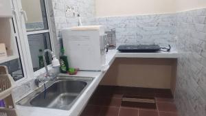 Kuchyň nebo kuchyňský kout v ubytování Margereth Cottage suite residence + 5 fotografií