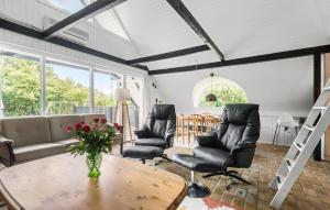 a living room with a couch and chairs and a table at 3 Bedroom Lovely Home In Hemmet in Hemmet