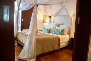 מיטה או מיטות בחדר ב-La Varangue