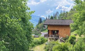a small wooden cabin in the middle of a forest at Chalet La Ponote in Samoëns