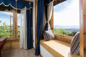 Χώρος καθιστικού στο Lijiang Zen Garden Hotel