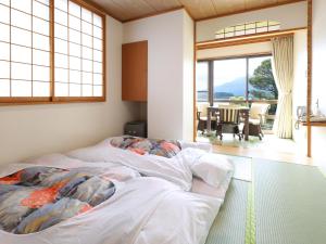 Llit o llits en una habitació de Hotel Koryu