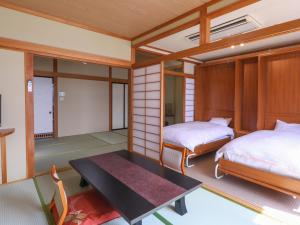 Llit o llits en una habitació de Hotel Koryu 75 fotos més