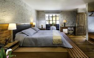 Postel nebo postele na pokoji v ubytování La Hostería Boutique Hotel