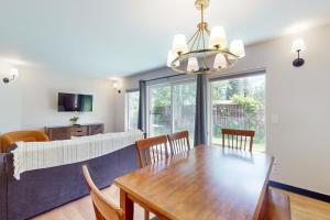a dining room with a table and a couch at Aspen Suites 505 & 506: Downtown Duo in Leavenworth