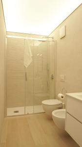 a bathroom with a shower and a toilet and a sink at Postcard in Alghero