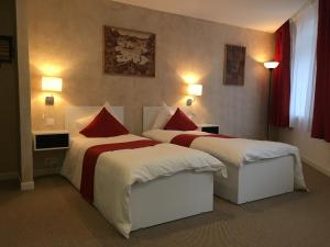 Postel nebo postele na pokoji v ubytování Csiki Hotel