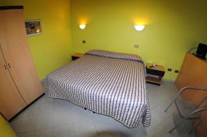 Un pat sau paturi într-o cameră la Residence Eden Park