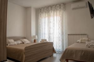 Postel nebo postele na pokoji v ubytování B&B Santa Filomena