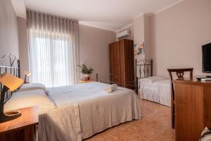 Katil atau katil-katil dalam bilik di Hotel Ristorante L'Orizzonte