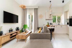 a living room with a couch and a table at Casa Moca in Chania Town