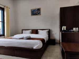 Letto o letti in una camera di Spring Inn Bir-Billing