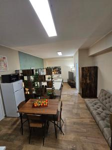 a living room with a table and a couch at RC SUITE Annunziata in Termini Imerese +17 photos
