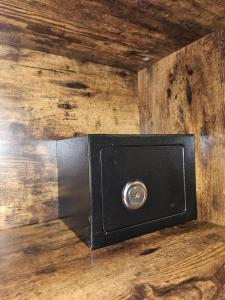 a black box sitting on a wooden floor at RC SUITE Annunziata in Termini Imerese