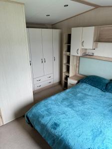 Ένα ή περισσότερα κρεβάτια σε δωμάτιο στο Cosy Retreat