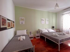 a bedroom with two beds with towels on them at Cipro Home in Rome