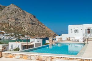 a view of a swimming pool with a mountain in the background at Villa Frazeska in Kamares