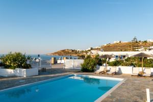 a swimming pool with a view of the ocean at Naoussa Hotel Paros by Booking Kottas in Naousa